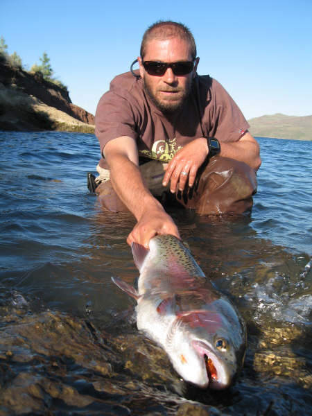Rodrigo Amadeo with a nice rainbow trout caught fly fishing in Patagonia